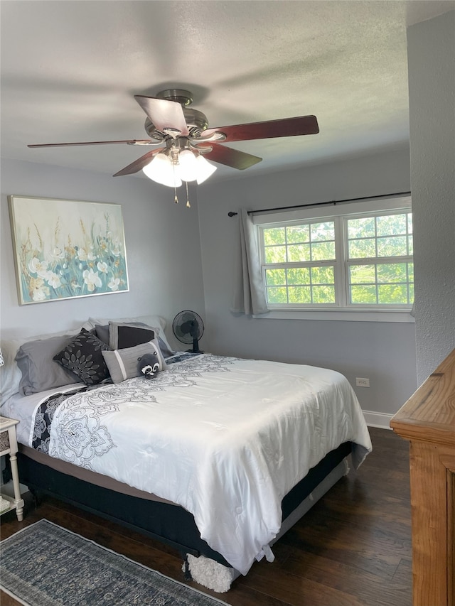 2620 County Road 1102, Grandview, TX 76050 - bedroom with wood finished floors, a ceiling fan, and baseboards
