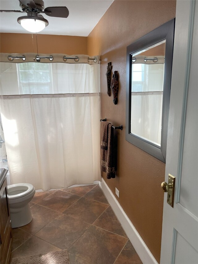 2620 County Road 1102, Grandview, TX 76050 - bathroom with toilet, a shower with shower curtain, ceiling fan, and vanity