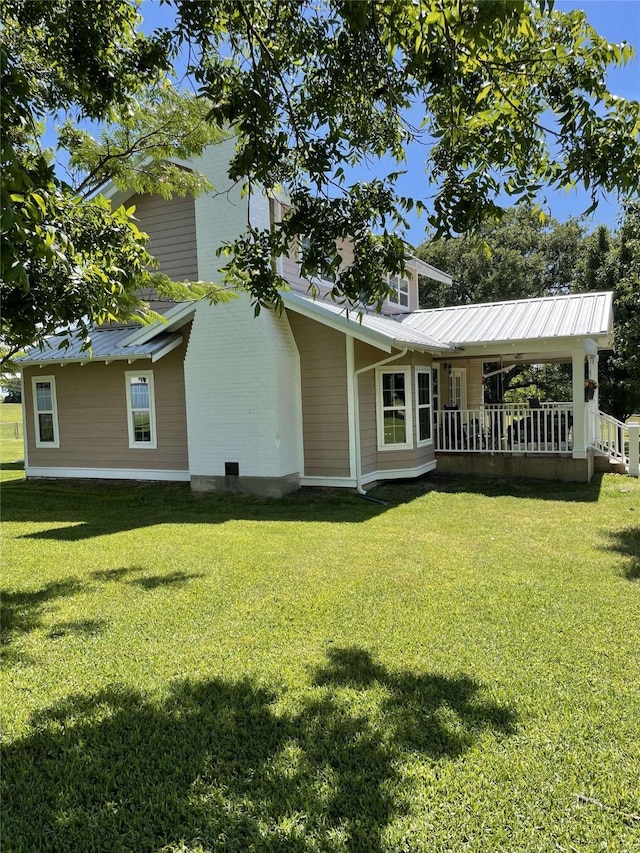 2620 County Road 1102, Grandview, TX 76050 - rear view of house with a yard and metal roof