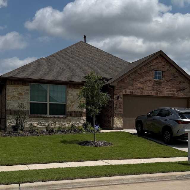 5213 Meadow Ln, Krum, TX 76249 - view of front of home featuring a shingled roof, a front lawn, an attached garage, and stone siding