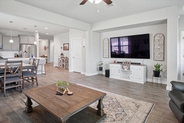 5213 Meadow Ln, Krum, TX 76249 - living room with a ceiling fan, light wood-style floors, baseboards, and recessed lighting