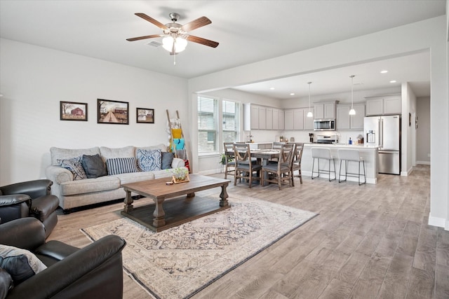 5213 Meadow Ln, Krum, TX 76249 - living area with light wood-style floors, baseboards, recessed lighting, and ceiling fan