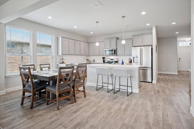 5213 Meadow Ln, Krum, TX 76249 - dining room with light wood-type flooring, baseboards, and recessed lighting