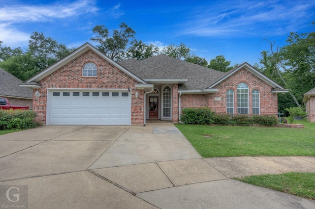 4002 Wilderness Ln, Bossier City, LA 71111 - view of front facade with brick siding, a front yard, roof with shingles, a garage, and driveway