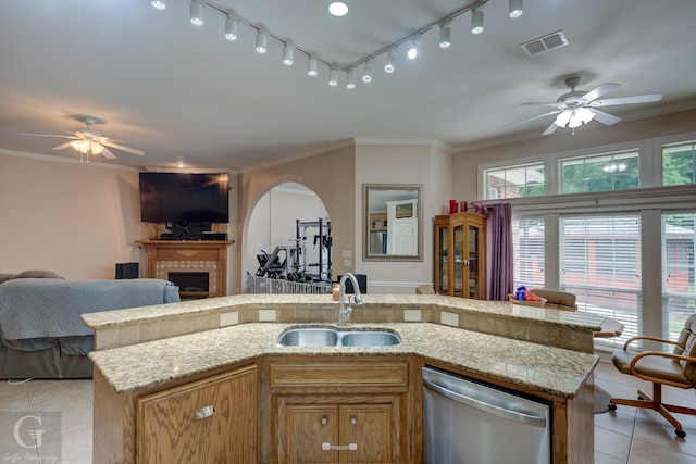 4002 Wilderness Ln, Bossier City, LA 71111 - kitchen featuring dishwasher, a sink, ceiling fan, open floor plan, and light tile patterned floors