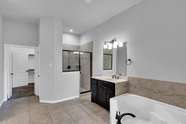 417 Sagebrush Ln, Waxahachie, TX 75165 - bathroom with a shower stall, vanity, a bath, tile patterned floors, and baseboards