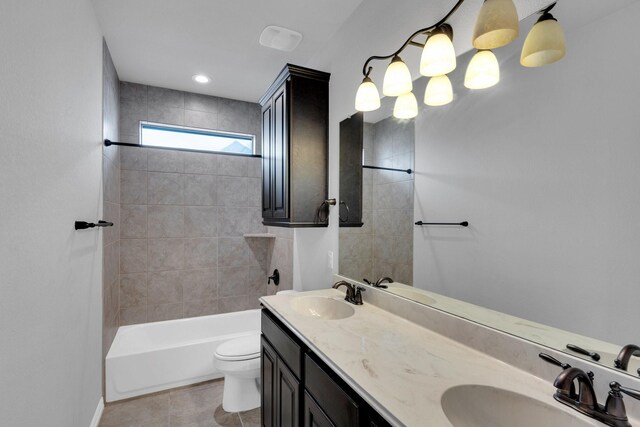 417 Sagebrush Ln, Waxahachie, TX 75165 - bathroom featuring double vanity, toilet, tile patterned floors, and tub / shower combination