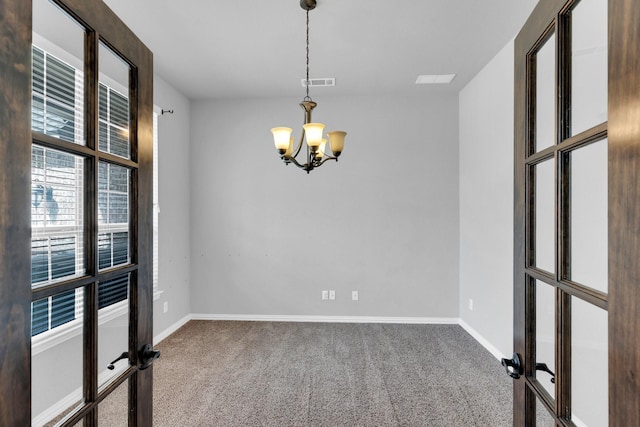 417 Sagebrush Ln, Waxahachie, TX 75165 - carpeted empty room featuring a chandelier, baseboards, and french doors