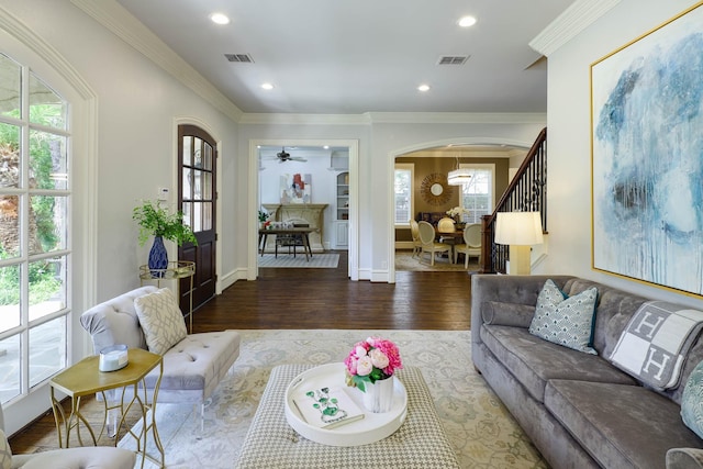 2900 Amherst Ave, University Park, TX 75225 - living area featuring arched walkways, wood finished floors, plenty of natural light, recessed lighting, and crown molding