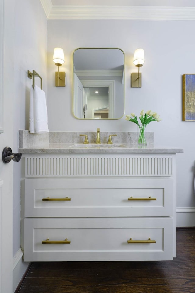 2900 Amherst Ave, University Park, TX 75225 - bathroom featuring vanity, crown molding, wood finished floors, and baseboards