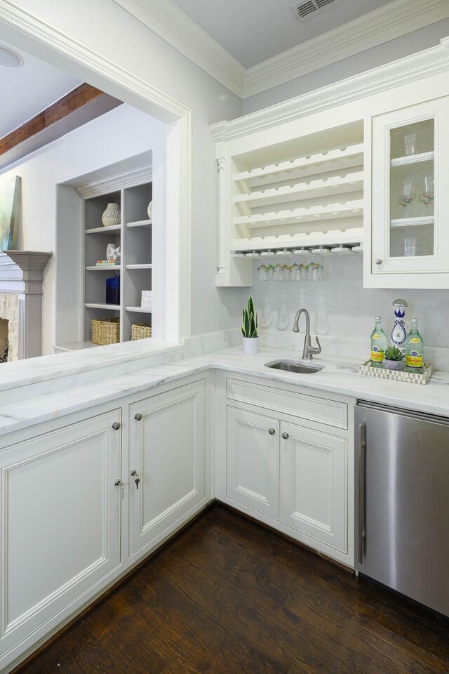 2900 Amherst Ave, University Park, TX 75225 - indoor wet bar featuring stainless steel refrigerator, dark wood-type flooring, and ornamental molding
