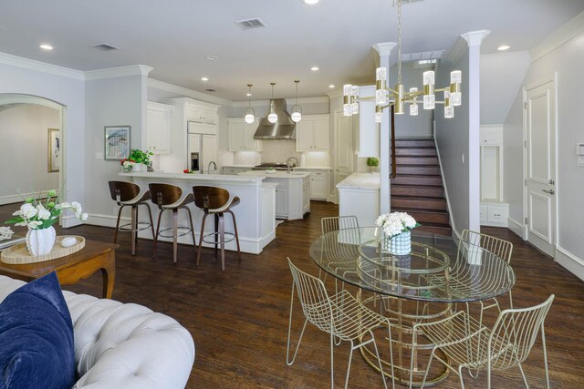 2900 Amherst Ave, University Park, TX 75225 - dining room with dark wood-type flooring, baseboards, recessed lighting, ornamental molding, and arched walkways
