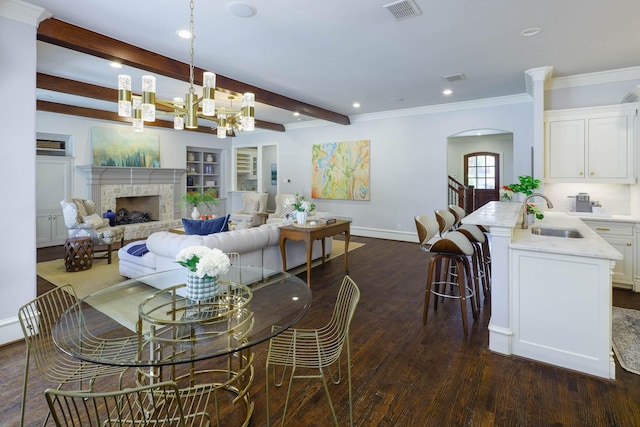 2900 Amherst Ave, University Park, TX 75225 - dining space featuring dark wood finished floors, a chandelier, baseboards, beamed ceiling, and recessed lighting