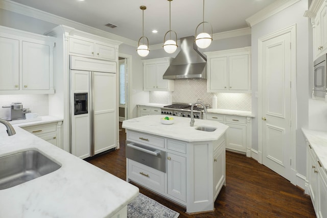 2900 Amherst Ave, University Park, TX 75225 - kitchen featuring a warming drawer, paneled built in fridge, wall chimney range hood, a sink, and ornamental molding