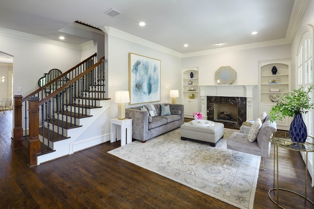 2900 Amherst Ave, University Park, TX 75225 - living area featuring wood finished floors, a premium fireplace, ornamental molding, stairway, and built in shelves