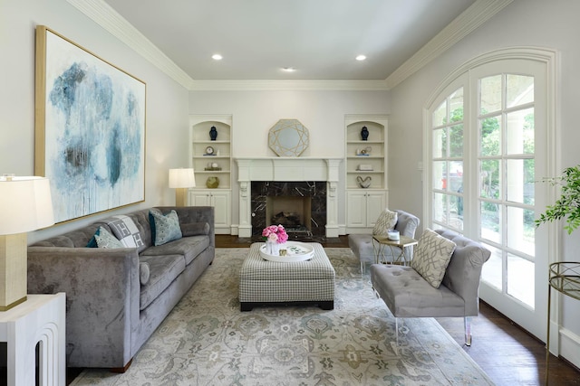 2900 Amherst Ave, University Park, TX 75225 - living room featuring wood finished floors, built in features, a premium fireplace, ornamental molding, and recessed lighting