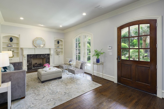2900 Amherst Ave, University Park, TX 75225 - living area featuring crown molding, a fireplace, wood finished floors, built in features, and baseboards