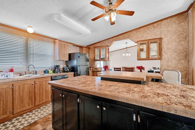 115 Candlewood Cir, Gainesville, TX 76240 - kitchen featuring black appliances, lofted ceiling, light countertops, a textured ceiling, and ceiling fan