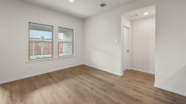 504 Drake Dr, Ferris, TX 75125 - unfurnished room featuring wood finished floors and recessed lighting
