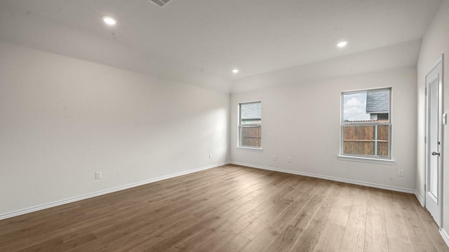504 Drake Dr, Ferris, TX 75125 - unfurnished room with wood finished floors and recessed lighting