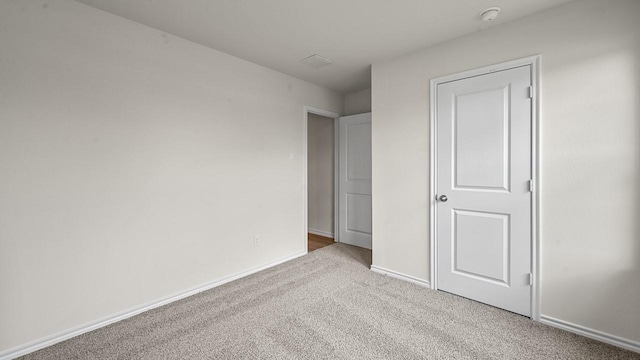 504 Drake Dr, Ferris, TX 75125 - unfurnished bedroom featuring carpet floors and baseboards