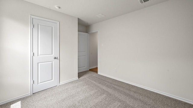 504 Drake Dr, Ferris, TX 75125 - unfurnished bedroom featuring carpet flooring and baseboards