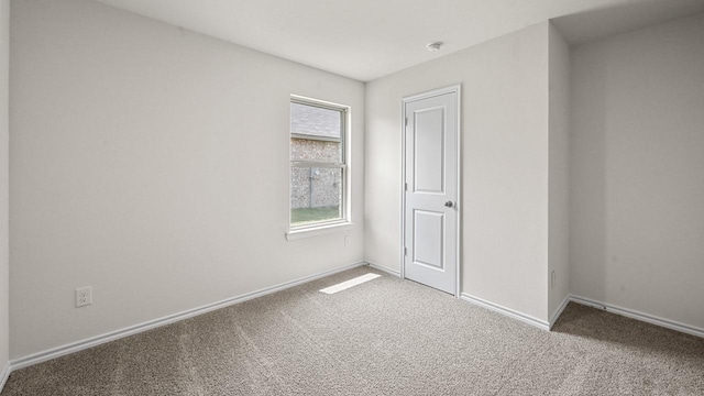 504 Drake Dr, Ferris, TX 75125 - unfurnished bedroom featuring carpet and baseboards