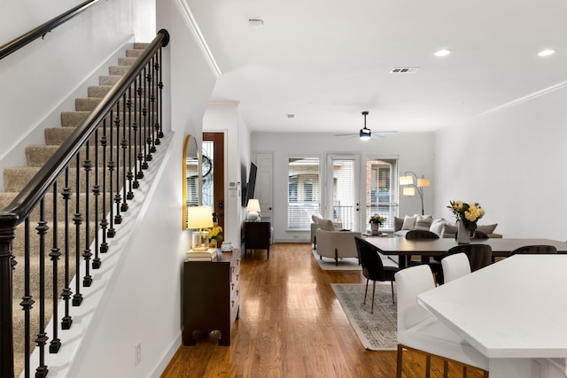 2408 Wild Cherry Way, Dallas, TX 75206 - dining space with stairs, recessed lighting, ceiling fan, wood finished floors, and ornamental molding