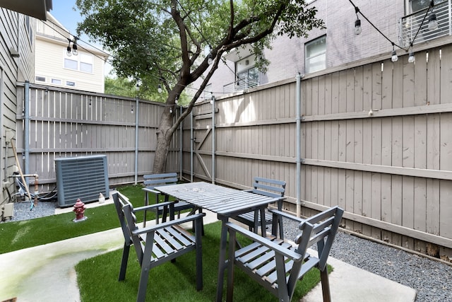 2408 Wild Cherry Way, Dallas, TX 75206 - view of patio / terrace with central AC and outdoor dining area