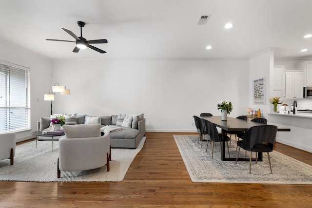 2408 Wild Cherry Way, Dallas, TX 75206 - living area with crown molding, ceiling fan, recessed lighting, baseboards, and wood finished floors