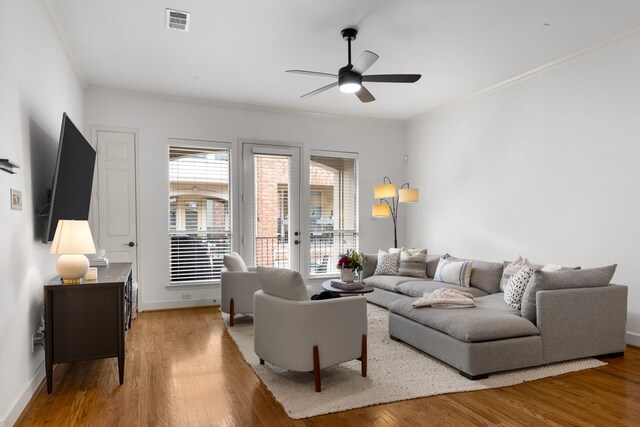 2408 Wild Cherry Way, Dallas, TX 75206 - living room with a ceiling fan, french doors, wood finished floors, and ornamental molding