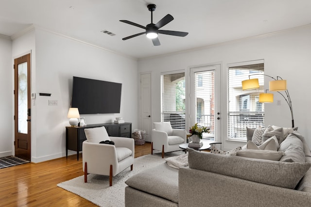 2408 Wild Cherry Way, Dallas, TX 75206 - living room with crown molding, wood finished floors, ceiling fan, and baseboards