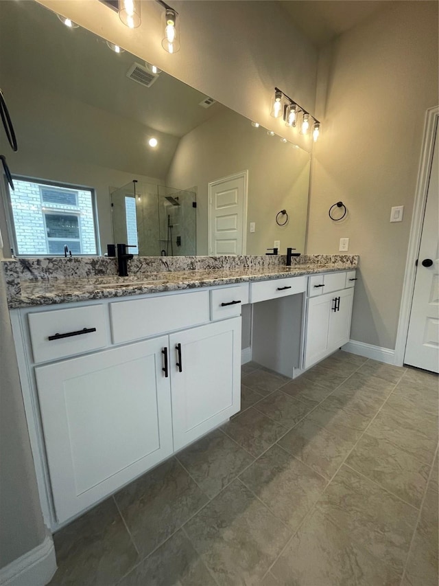 6113 Rodin Dr, Royse City, TX 78189 - full bathroom with vanity, a stall shower, baseboards, tile patterned flooring, and vaulted ceiling