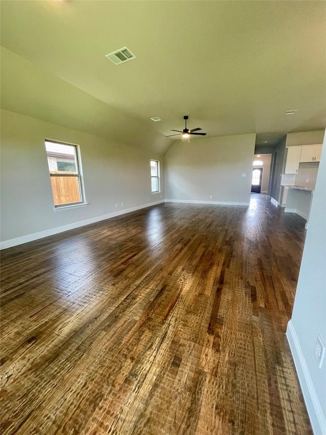 6113 Rodin Dr, Royse City, TX 78189 - unfurnished room with ceiling fan, dark wood-type flooring, plenty of natural light, baseboards, and vaulted ceiling