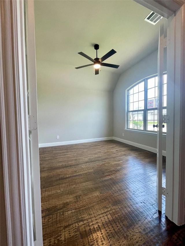 6113 Rodin Dr, Royse City, TX 78189 - unfurnished room featuring vaulted ceiling, baseboards, dark wood finished floors, and a ceiling fan