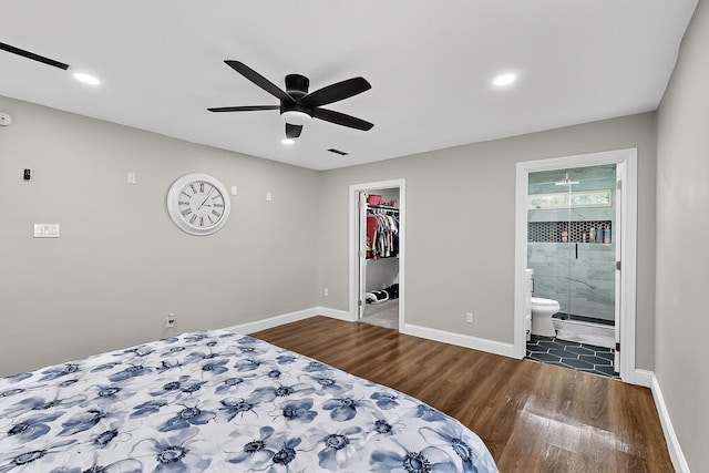 3039 Dutton Dr, Dallas, TX 75211 - bedroom featuring wood finished floors, a spacious closet, baseboards, and recessed lighting