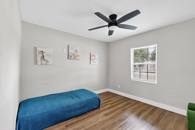 3039 Dutton Dr, Dallas, TX 75211 - bedroom featuring wood finished floors, baseboards, and ceiling fan