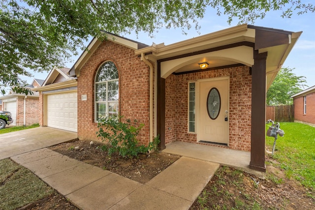 648 Tabasco Trl, Arlington, TX 76002 - view of front of home with an attached garage, driveway, and brick siding