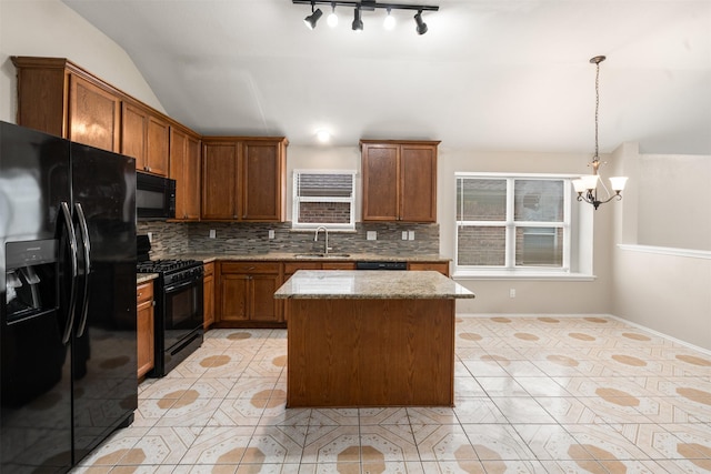 648 Tabasco Trl, Arlington, TX 76002 - kitchen with black appliances, a sink, backsplash, light stone countertops, and vaulted ceiling