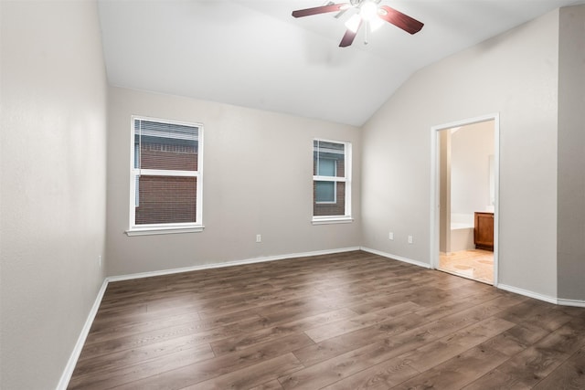 648 Tabasco Trl, Arlington, TX 76002 - spare room featuring lofted ceiling, a ceiling fan, dark wood-type flooring, and baseboards