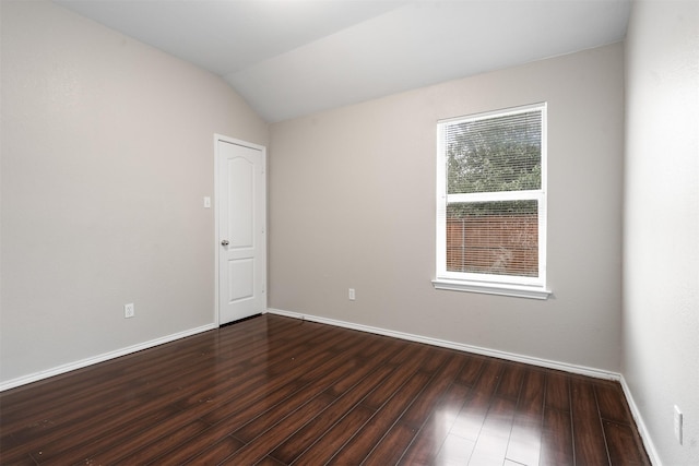 648 Tabasco Trl, Arlington, TX 76002 - empty room with dark wood finished floors, baseboards, and vaulted ceiling