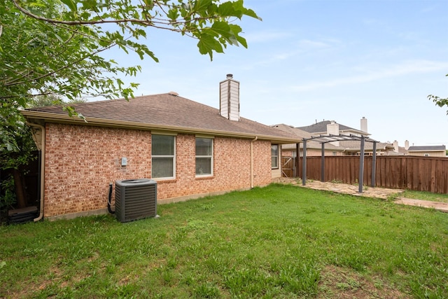 648 Tabasco Trl, Arlington, TX 76002 - rear view of property featuring central AC unit, a pergola, brick siding, and a chimney