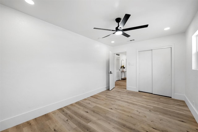 4100 N 30th St, Waco, TX 76708 - unfurnished bedroom with baseboards, light wood-style floors, a closet, recessed lighting, and a ceiling fan