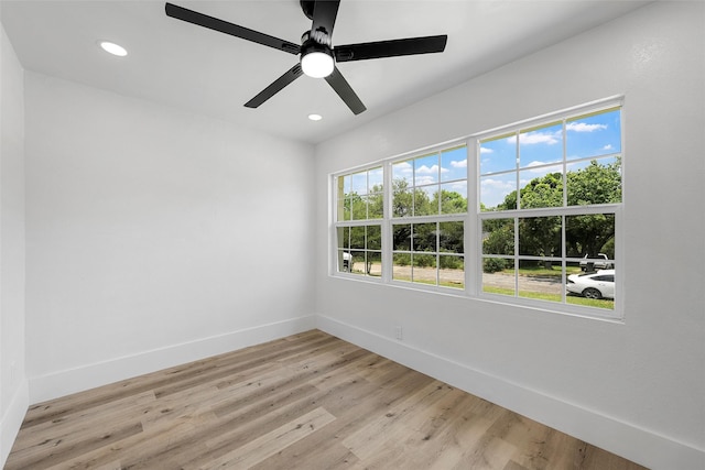 4100 N 30th St, Waco, TX 76708 - spare room featuring healthy amount of natural light, baseboards, light wood finished floors, and recessed lighting