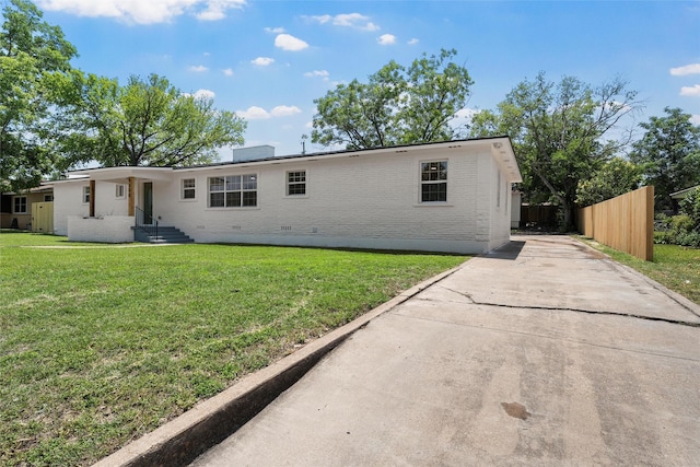 4100 N 30th St, Waco, TX 76708 - view of front of property featuring brick siding, concrete driveway, and crawl space
