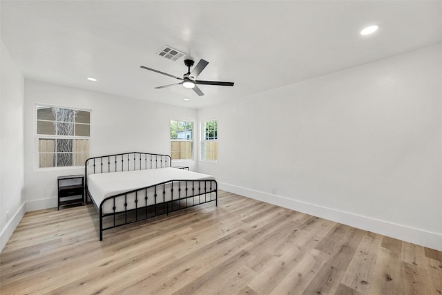 4100 N 30th St, Waco, TX 76708 - bedroom featuring baseboards, light wood-type flooring, recessed lighting, and a ceiling fan