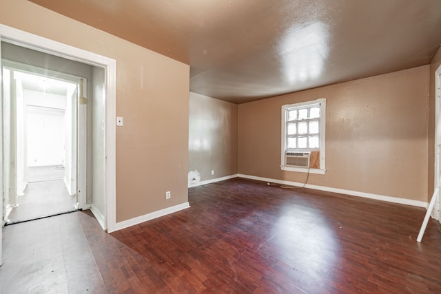 4722 Cowan Ave, Dallas, TX 75209 - unfurnished room featuring wood finished floors, baseboards, and cooling unit