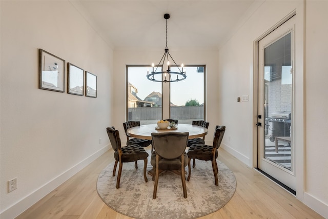 12104 Fairway Meadows Dr, Fort Worth, TX 76179 - dining space featuring a chandelier, light wood-style flooring, and crown molding