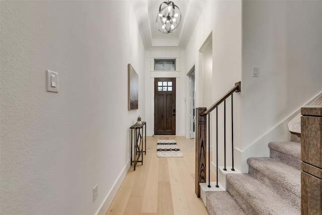12104 Fairway Meadows Dr, Fort Worth, TX 76179 - foyer with light wood finished floors, a chandelier, and stairway