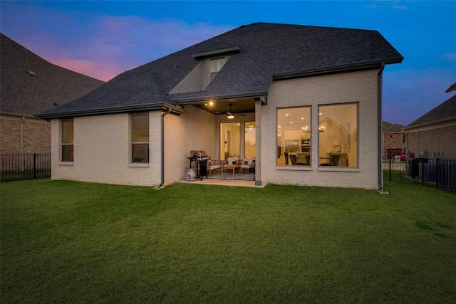 12104 Fairway Meadows Dr, Fort Worth, TX 76179 - back of house at dusk with a shingled roof, brick siding, a fenced backyard, a patio, and ceiling fan